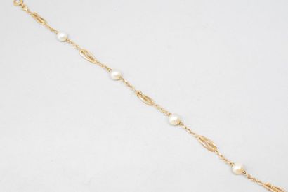 null Bracelet en or jaune 18k (750) à maille torsadée entrecoupée par des perles...