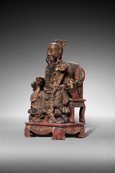 null CHINE - XIXe siècle

Statuette de divinité taoïste en bois laqué or et rouge,...