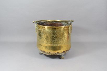 null Copper cauldron resting on a tripod base 

Middle East work 

H. 29 cm 