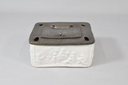 null White porcelain inkwell with putti decoration on the front and back, pewter...