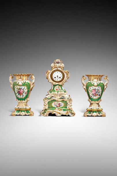 null Paris XIXth century 

Rococo style porcelain mantel set with green background...