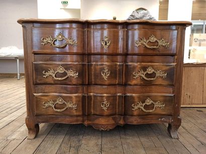 null 
Walnut crossbow chest of drawers with three drawers in front. Gilded bronze...