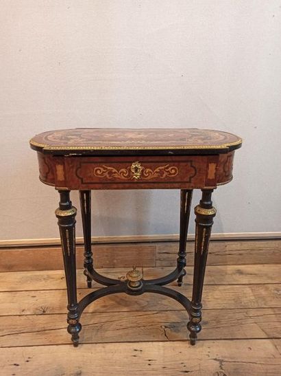 null 
Dressing table with inlaid decoration opening to a drawer with four compartments...