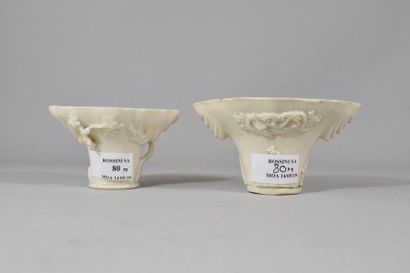 null Two libation cups in white Chinese porcelain decorated with characters surrounded...