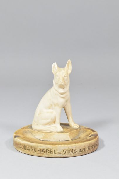 Ashtray in patinated plaster showing a seated...
