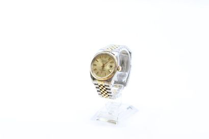 null ROLEX Gold and steel bracelet
watch. Round case and screwed case back. Champagne...