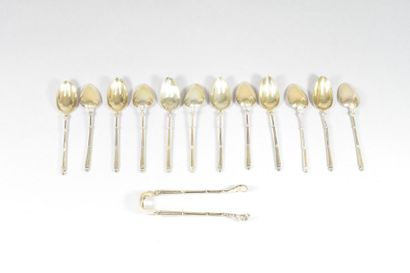 null Twelve teaspoons and a sugar tongs in vermeil, the truncated cone handles with...