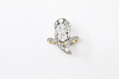 null An 18K (750) yellow gold and platinum ring set with an old fashioned cut diamond...