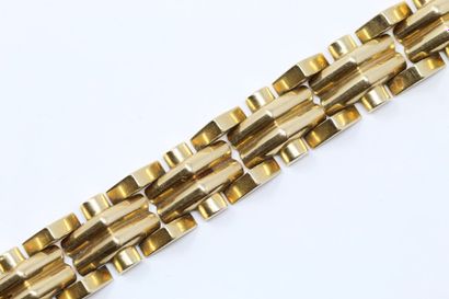 null Tank bracelet in 18K (750) yellow gold, articulated with double half-cylinder...