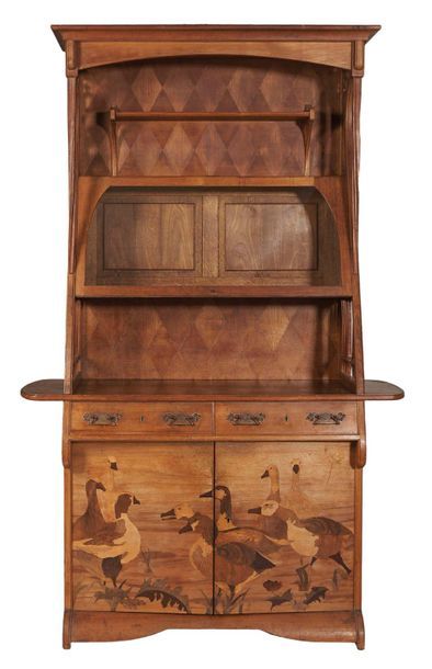 null Louis MAJORELLE (1859-1926)

Buffet Ducks in walnut with carved moulding and

inlaid...