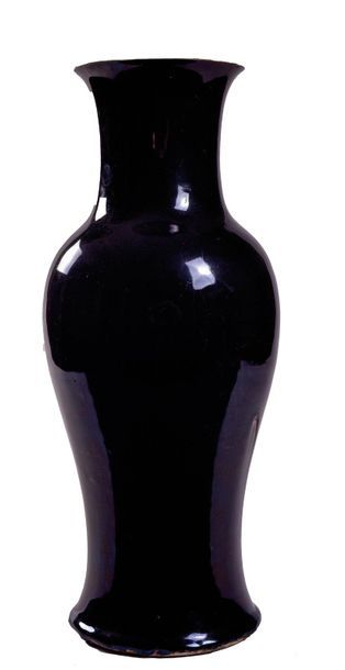 null CHINA - 19th century

Porcelain baluster vase with a black cover, a firing defect...