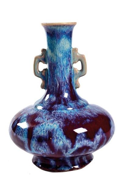 null CHINA - 20th century

Porcelain vase with a flamed glaze, the lower part of...