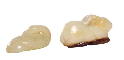 null CHINA

Three pieces of celadon and rust nephrite, including a reclining goat,...