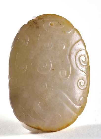 null CHINA - Early 20th century

Small oval-shaped celadon nephrite medallion decorated...