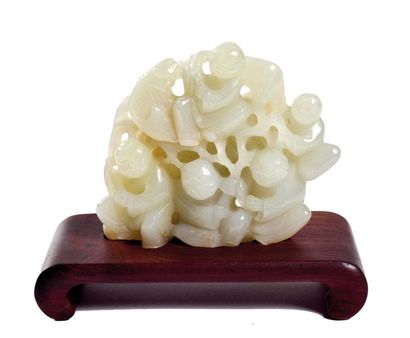 null CHINA - Early 20th century

Celadon nephrite group, five children holding

a...