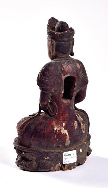 null CHINA - 19th century

Statuette of Guaynin in gold lacquered wood, sitting in...