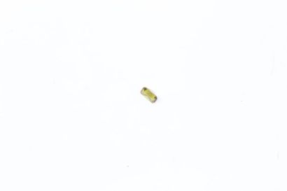 null Rectangular green-yellow sapphire with cut edges on paper. 

Weight: approx....
