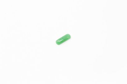 null Jade cabochon on paper. 

Weight: 5.20 cts. 