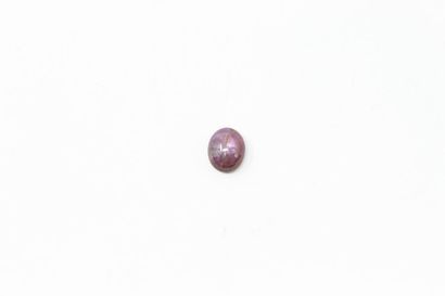 null Star ruby cabochon on paper. 

Weight: approx. 11.95 cts. 