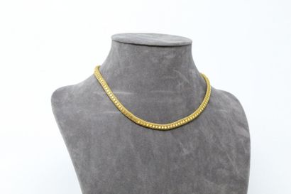 null Necklace in 18k (750) yellow gold with polish stitch covered discs.

Weight...