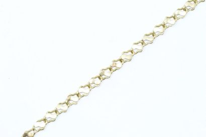 null 18k (750) yellow gold bracelet with fancy stitch. (Sets down). 

Wrist circumference:...