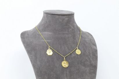 null 18k (750) yellow gold chain with three medals with a putti drop. 

Neck size:...