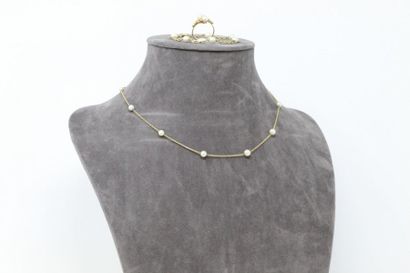 null 18k (750) yellow gold jewellery set including : 

- a chain link necklace alternating...