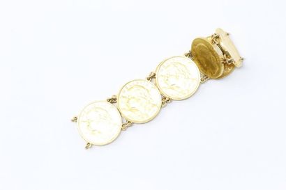 null Bracelet en or jaune 18k (750) orné de neuf pièces en or de 20 francs Vreneli....