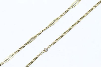 null 18k (750) yellow gold chain decorated with eight openwork shuttles in a forced...