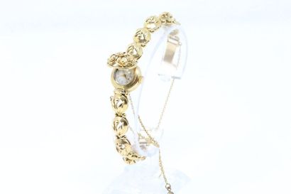 null Montre bracelet de dame en or jaune 18k (750), le bracelet articulé au décor...