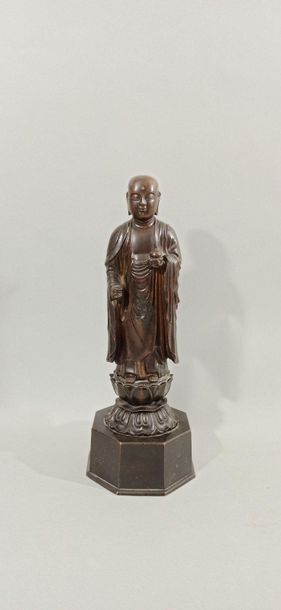  JAPAN - 19th century 
Statuette of Jizo Bosatsu in bronze with a brown patina, standing...