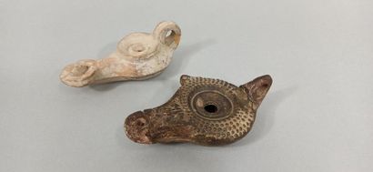 null Set of two oil lamps, one of which is a Hellenistic type with a louse decorated...