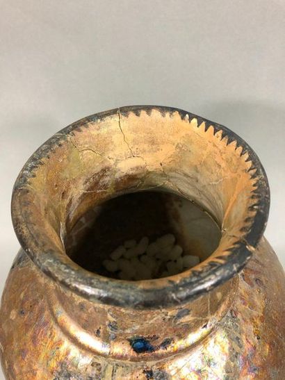 null IRAN, 14th century,

Ceramic vase of baluster shape, flared neck. 

Oydations,...