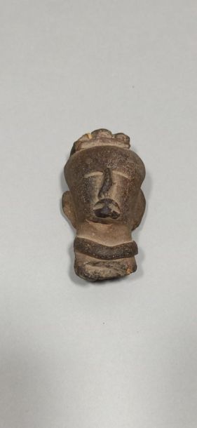  Three mesoamerican heads. 
Terracotta.