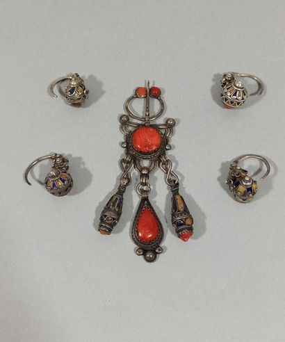 null Lot composed of a chased silver fibula decorated with a coral cabochon and three...