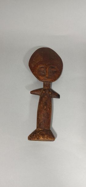 Wooden statuette with arms outstretched,...