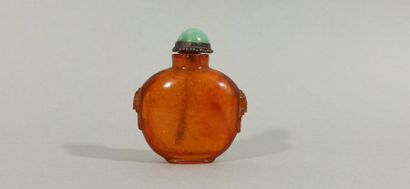 CHINA - 19th century 
Snuffbox bottle in amber, baluster-shaped, the handles representing...