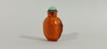  CHINA - 19th century 
Snuffbox bottle in amber, baluster-shaped, the handles representing...