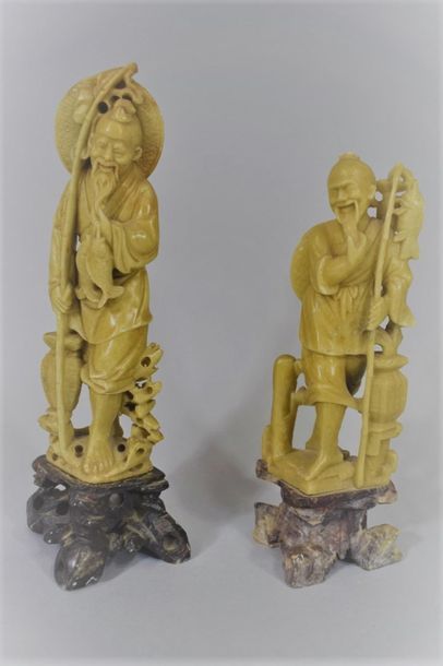  CHINA, circa 1900 
Two carved soapstone statuettes representing fishermen, 
H. 24,...