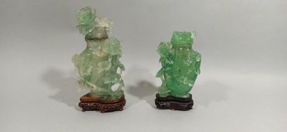  CHINA - 20th century 
Two small covered fluorite vases, with carved decoration of...