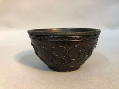 Coconut mug with carved decoration of a junk,...