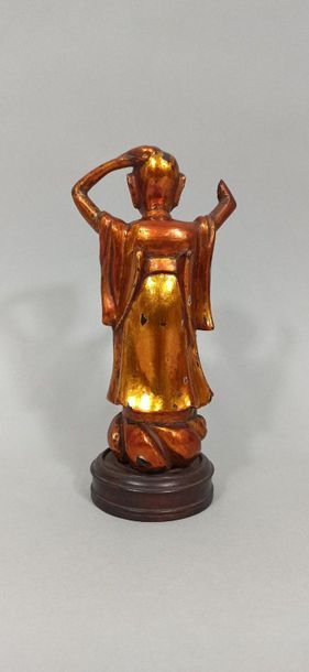 null CHINA - Around 1900

Statuette in gold lacquered wood, representing a young...