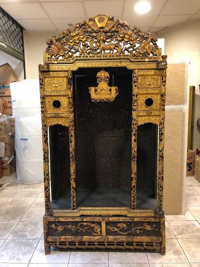null Black lacquered carved wooden Buddhist altar enhanced with gold, opening in...