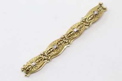null Bracelet en or jaune 18k (750) à motifs avec fermoir cliquet et chaînette de...