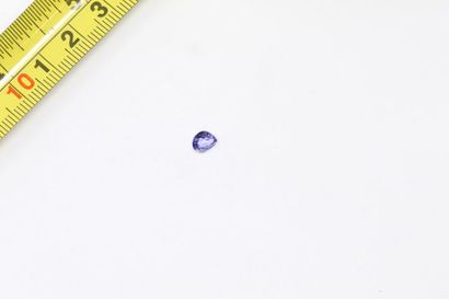 null Tanzanite drops on paper. 

Weight: approx. 0.80 ct. 
