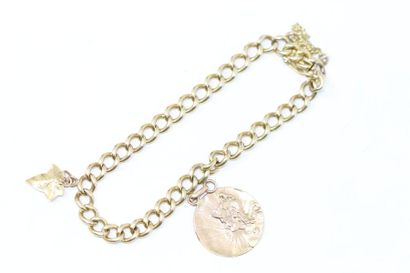 null 18k (750) yellow gold charm bracelet with gourmet chain link. 

Wrist circumference:...