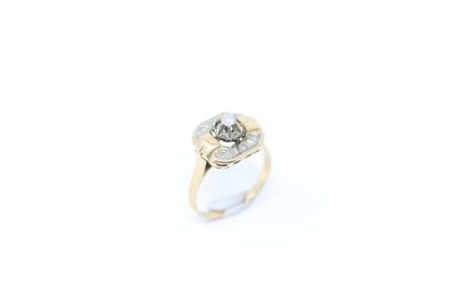 null 18k (750) yellow and white gold ring set with a diamond in a ring of rose-cut...