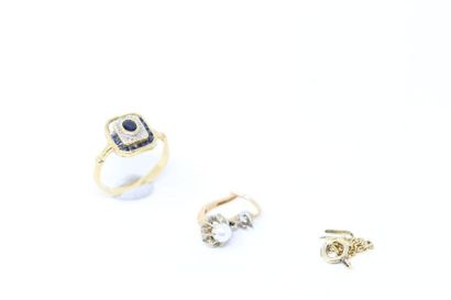 null Set of 18K (750) gold scrap consisting of a ring adorned with blue stones, an...