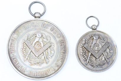 null Freemasonry. Two silver medals 

Front: G.O.D.F. FREEDOM.EQUALITY.FRATERNITY.SOLIDARITY

Reverse:...