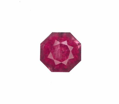null Shiny octagonal pink tourmaline. A metal frame is attached.

Probably Mozambique....
